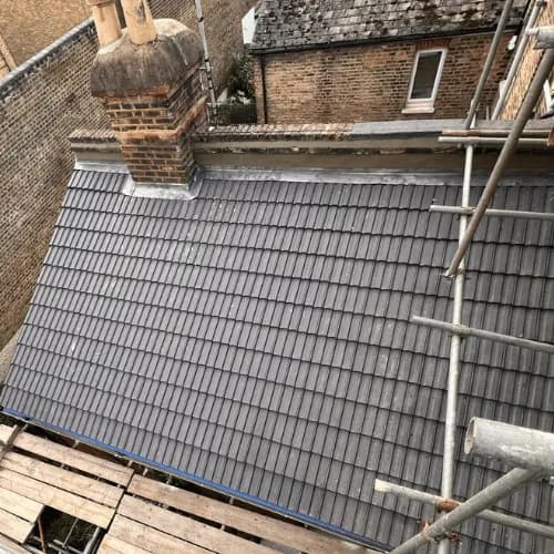 Tile roof replacement by Authentic Building & Roofing, Essex